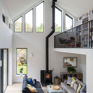 a double height space with mezzanine and stove