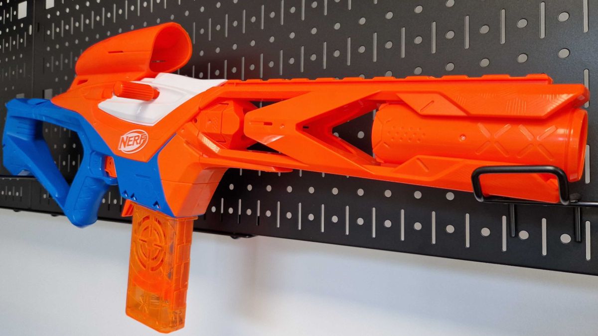 Nerf N-Series Pinpoint hanging on a black metallic surface