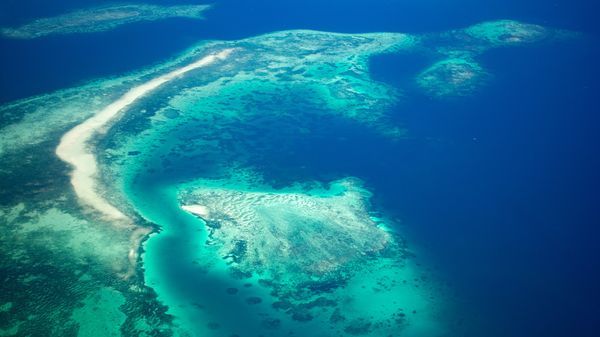 An aerial view of a tropical archipelago.