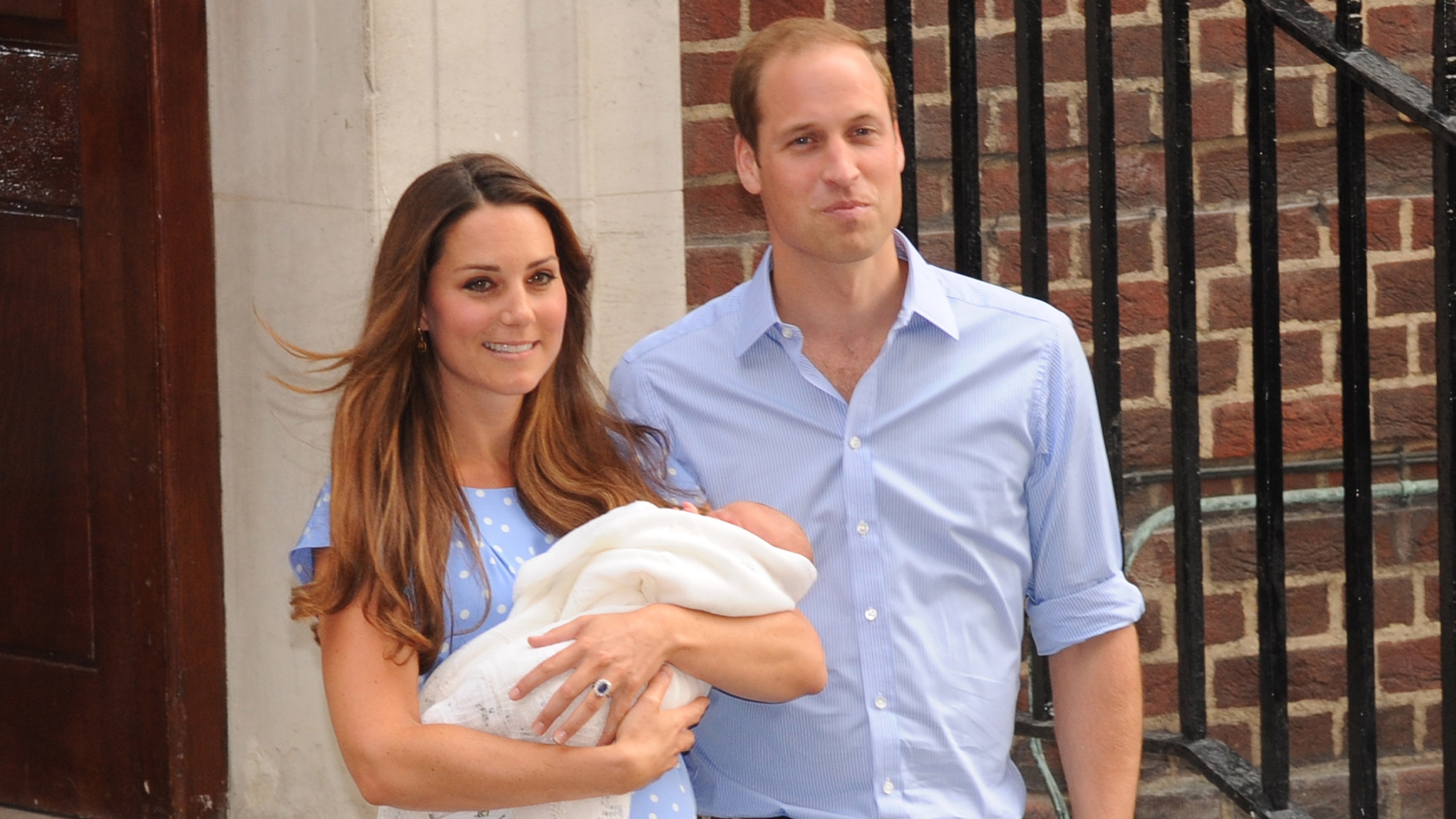 Catherine, Princess of Wales and Prince William stand outside The Lindo Wing with their newborn son Prince George at St Mary's Hospital on July 23, 2013