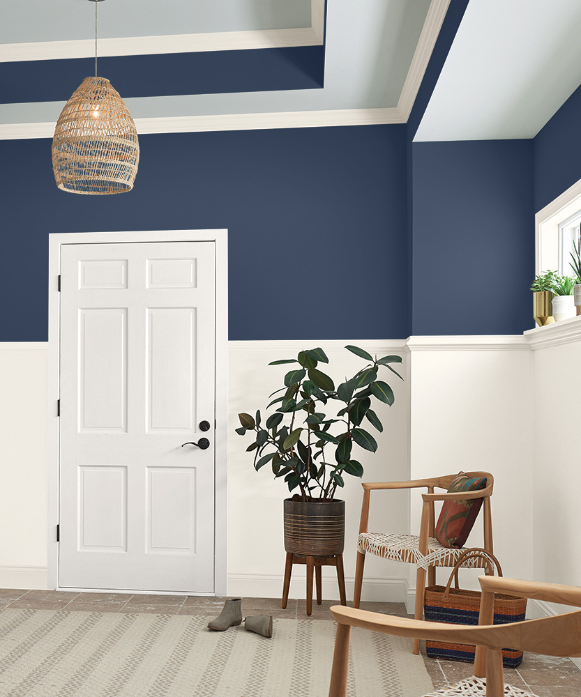 Dark blue painted walls paired with cream tones