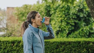 A runner uses an inhaler