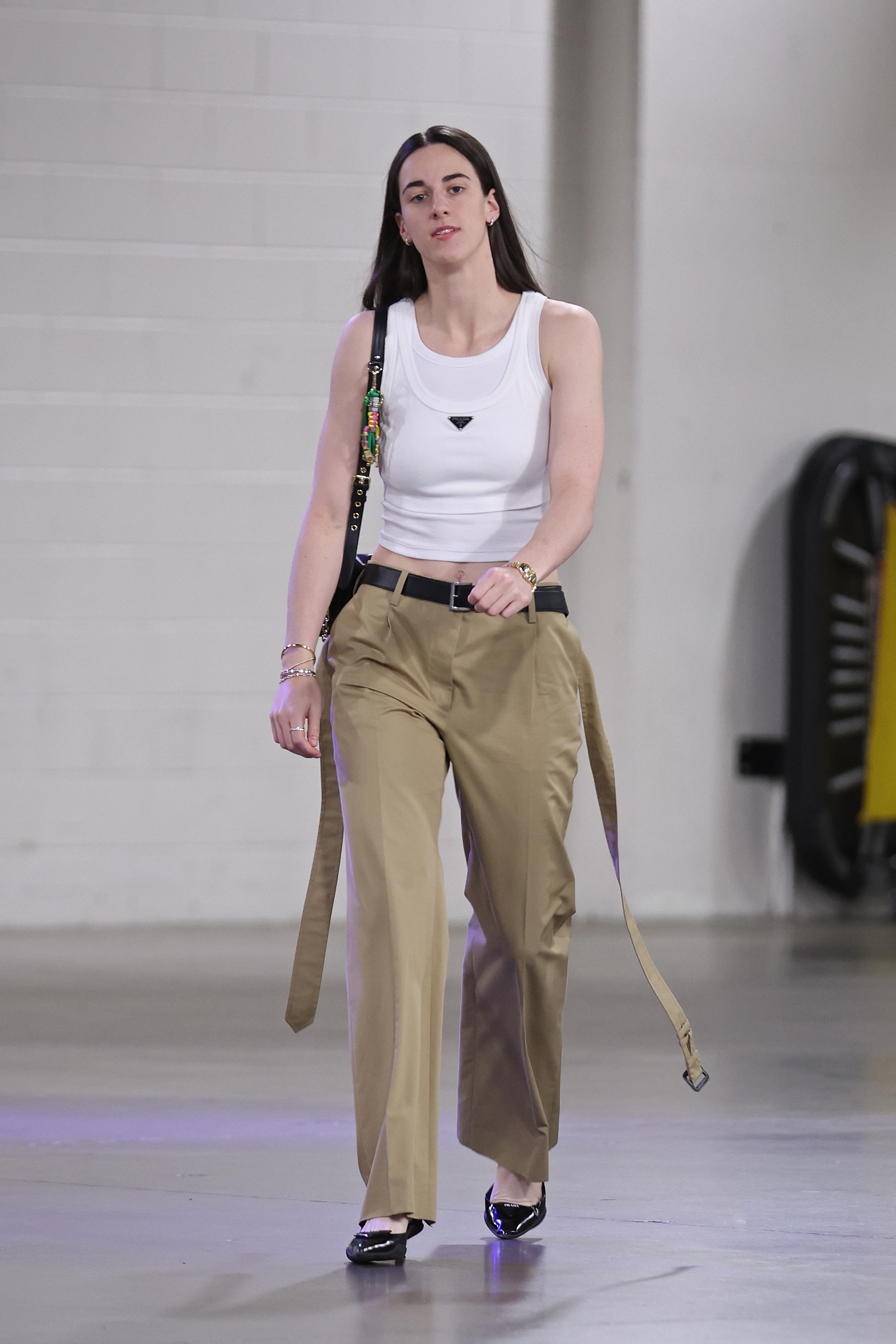 Caitlin Clark attends an Indiana Fever game wearing all prada