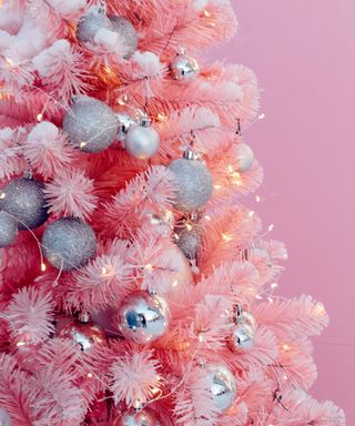 Beautiful Christmas pink tree on pink background