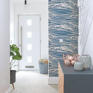 White hallway with blue wallpaper