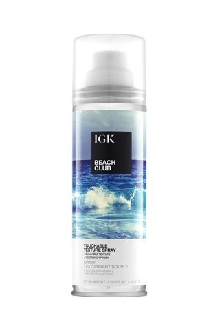 A bottle of IGK Beach Club texture spray set against a white background.