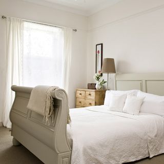 master bedroom with photoframe on white wall