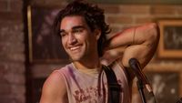 Josh Heuston as Justin in Off Campus. He's holding his right arm up and behind his neck.