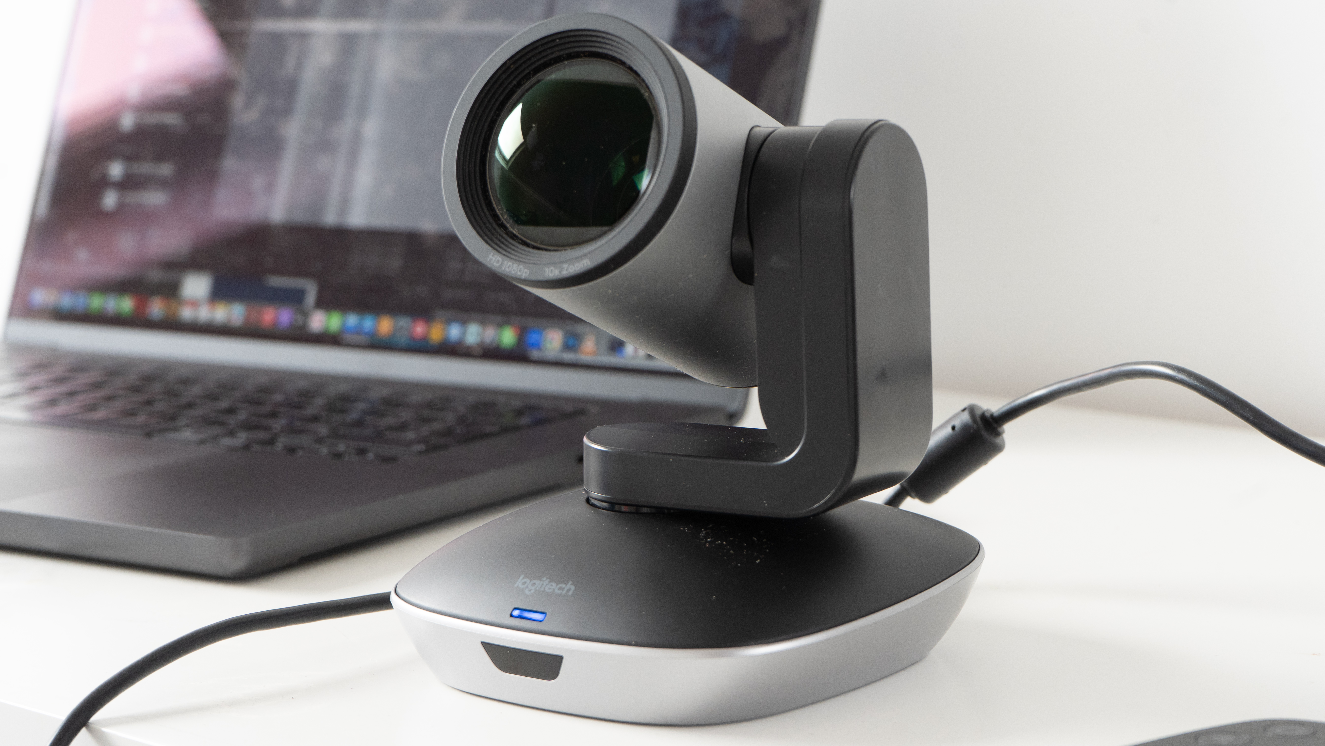 Logitech PTZ Pro 2 camera in front of a laptop