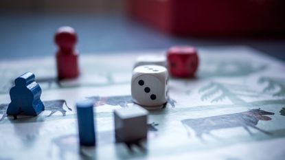 Best board game 2022: Image depicts dice and counters on board 