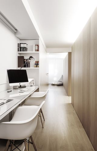 An apartment using corridor space as a home office