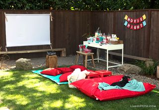 A makeshift outdoor movie theater in a backyard