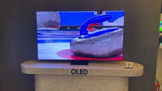 77-inch Samsung S95D OLED TV on its stand on dispaly at cES 2024