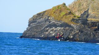 what is coasteering: group on the rocks