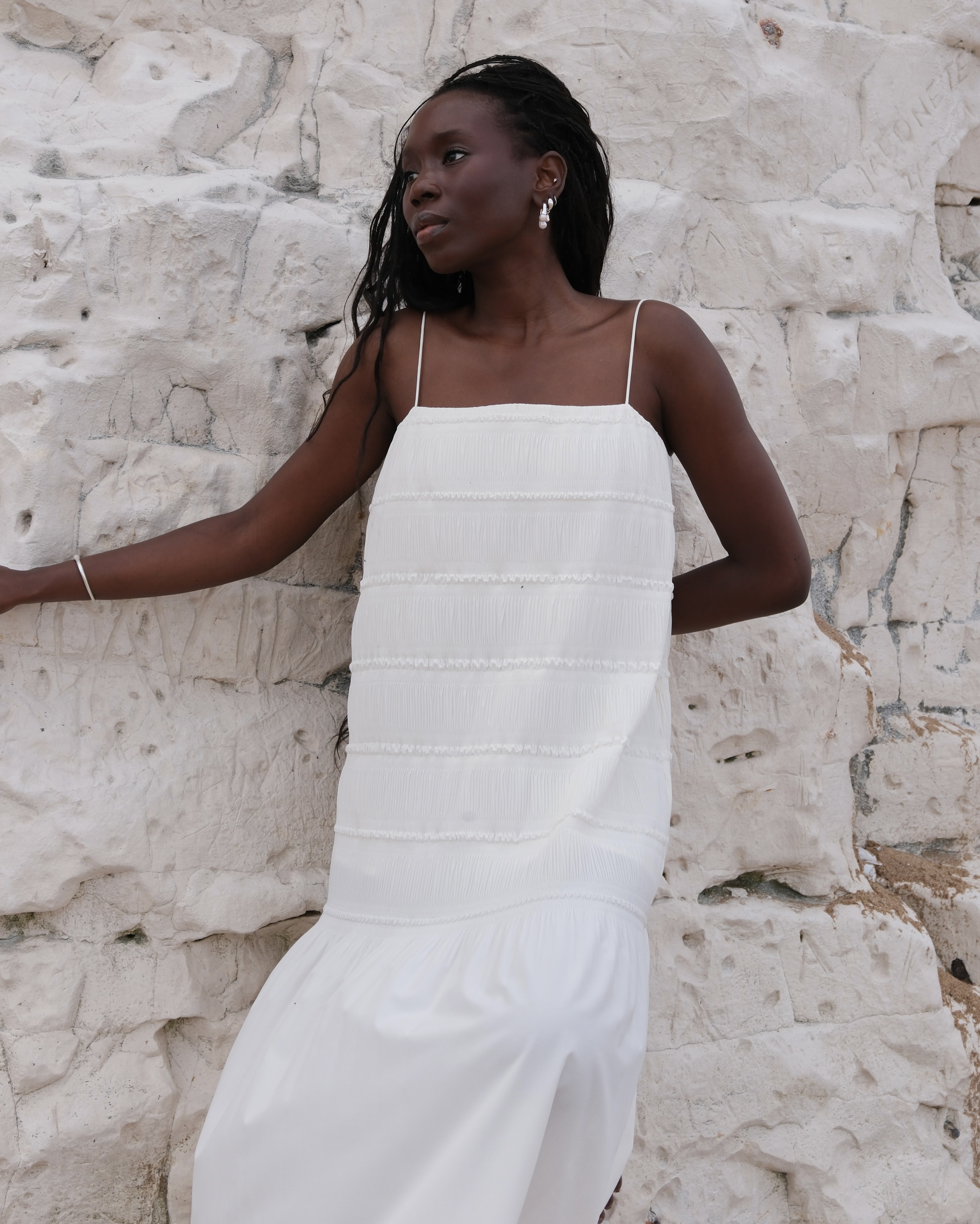 Daniella wearing a white cos dress