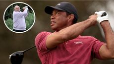 Tiger Woods hits a tee shot with a driver and watches its flight