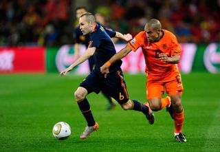 Spain's Andres Iniesta is challenged by the Netherlands' Nigel De Jong in the 2010 World Cup final.