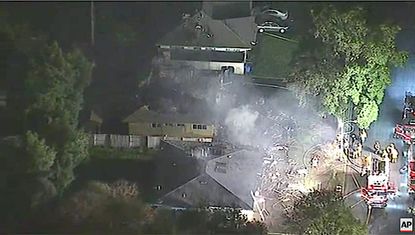 A plane hit two houses in Riverside, California, killing three