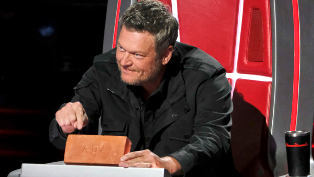 Blake Shelton holds a brick that says Ada gifted to him on The Voice