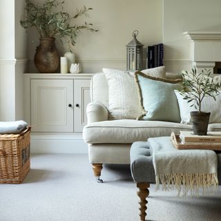 Cream living room with cream sofa and cream carpet