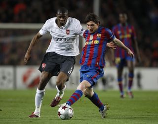 Lionel Messi, battling with Arsenal's Abou Diaby, scored a record 672 goals in 778 games for Barcelona