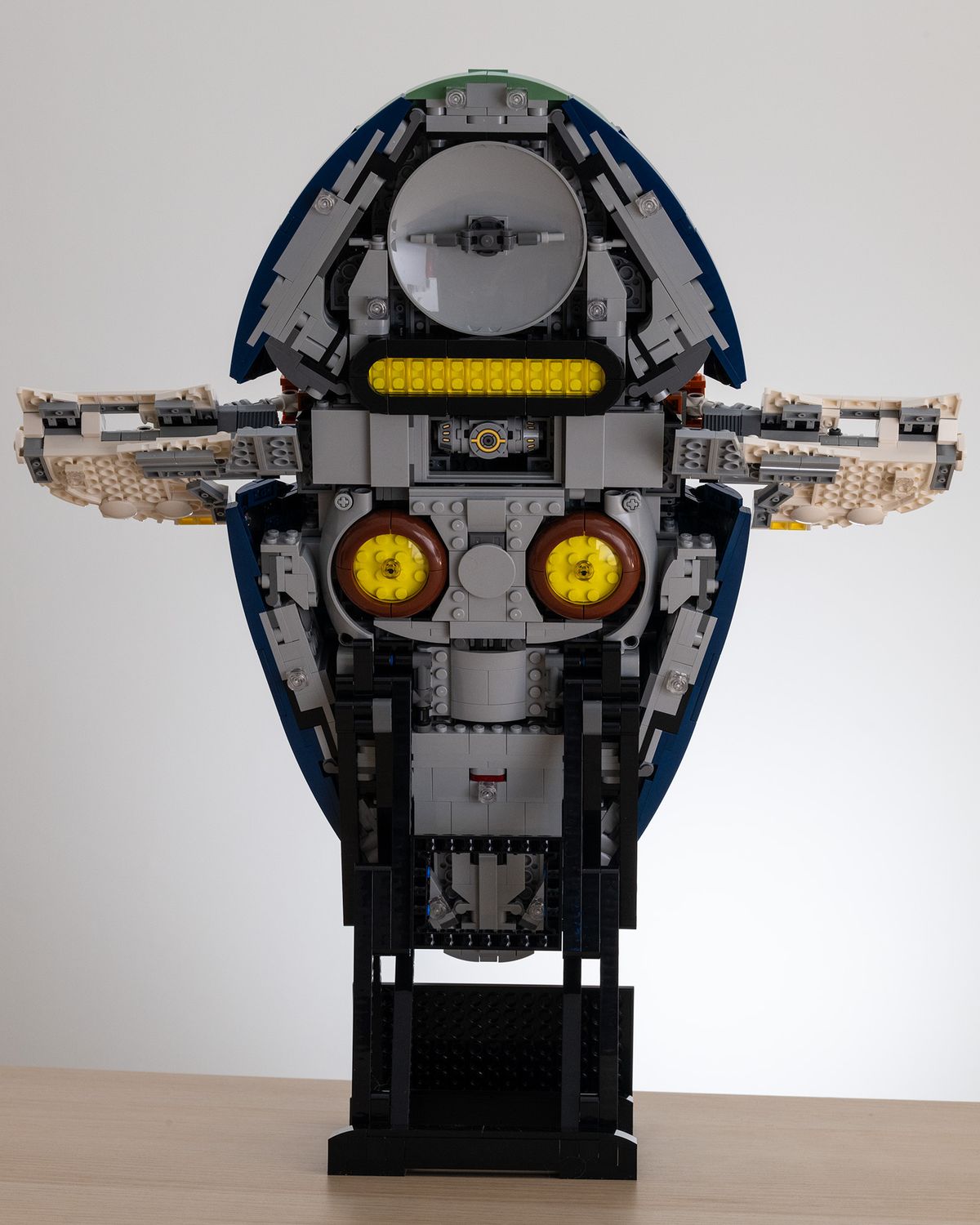 Lego Star Wars UCS Jango Fett&rsquo;s Firespray-Class Starship (75409) on a table with a white background rear image