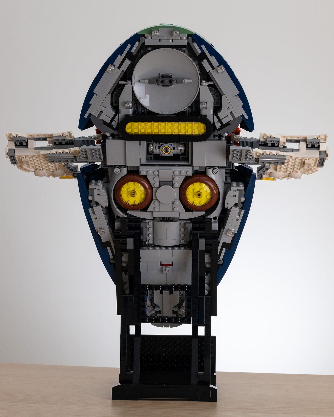 Lego Star Wars UCS Jango Fett&rsquo;s Firespray-Class Starship (75409) on a table with a white background rear image