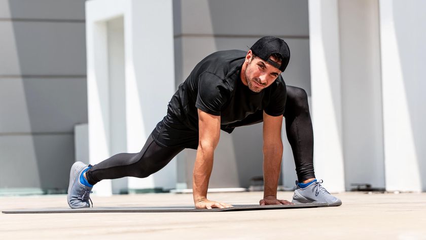 a man doing the Spiderman stretch