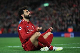 Mohamed Salah takes a moment of calm after scoring against Huddersfield