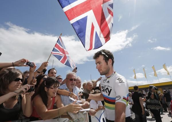British flags fly over Mark Cavendish as he is greeted by girlfriend Peta Todd and baby Delilah