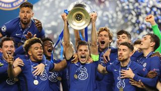 Cesar Azpilicueta of Chelsea lifts the Champions League Trophy following their team's victory in the UEFA Champions League Final between Manchester City and Chelsea FC at Estadio do Dragao on May 29, 2021