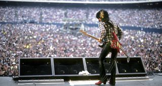 Joe Perry shot from behind as he looks out to a packed stadium in New Jersey, 1978