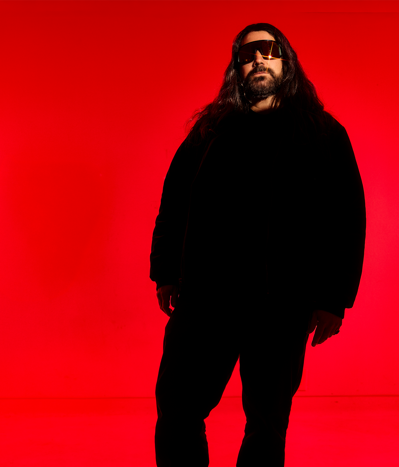 Members of Health shot against a stark red background