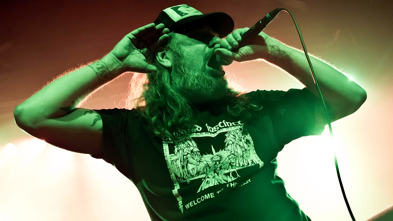 Tomas Lindberg fronting At The Gates onstage in 2014