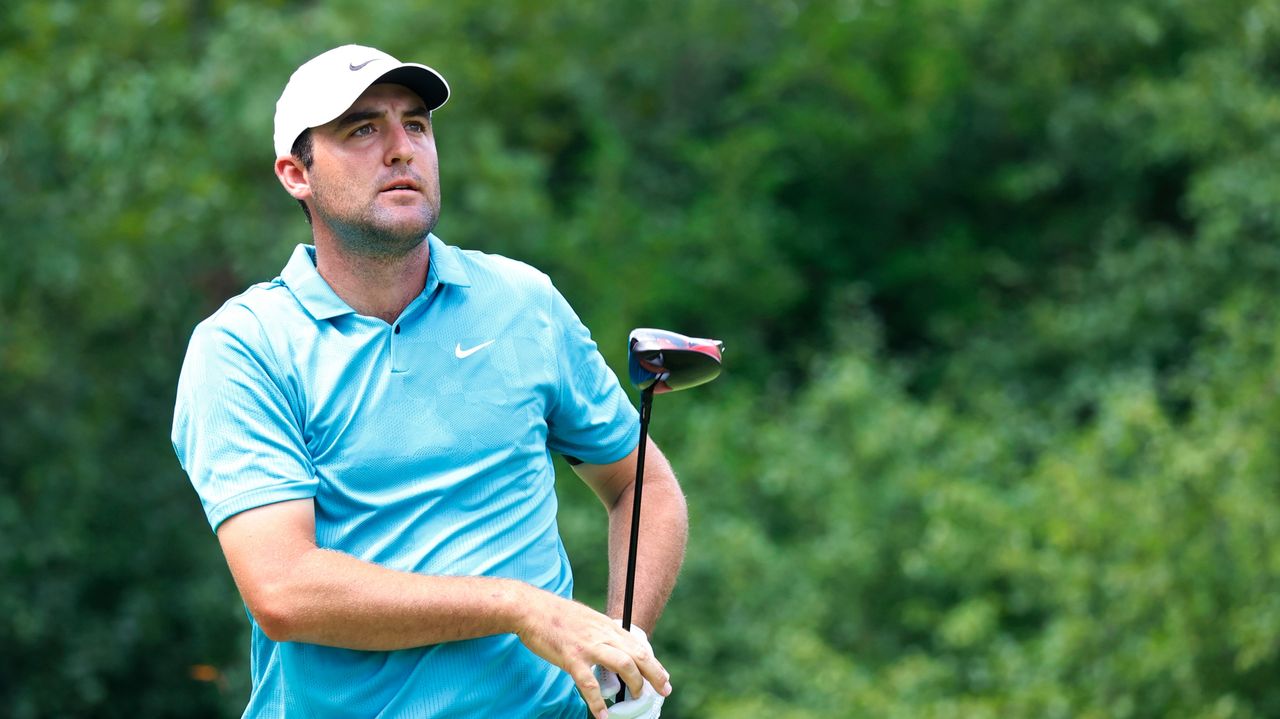 Scottie Scheffler plays his tee shot on the 3rd hole during the final round of the BMW Championship.