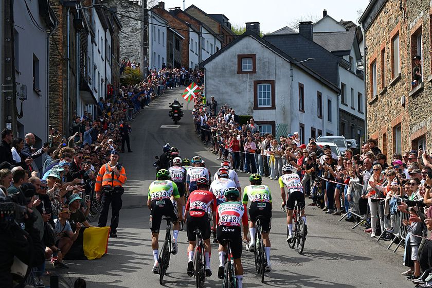 Riders from several teams race uphill during Liege-Bastogne-Liege 