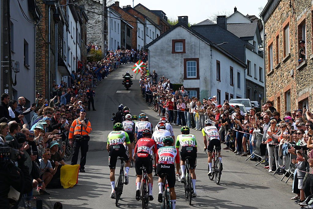 Riders from several teams race uphill during Liege-Bastogne-Liege 