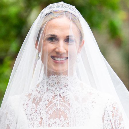 Harriet Sperling wearing a veil and wedding dress