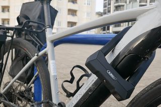 Abus super extreme in use at a bike rack, locking an ebike up