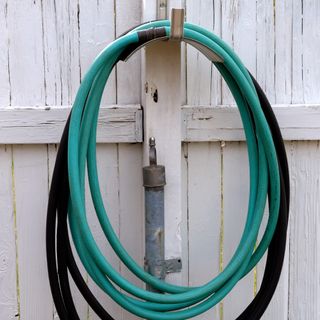 A garden hose on a hook