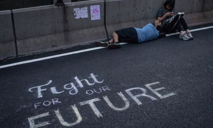 Protesters in Hong Kong rest in the street