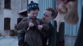 Gunnar Tofte hugging his son, Ole in Narvik.