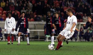 Ronald De Boer (right) executes his penalty but fails to hit the target