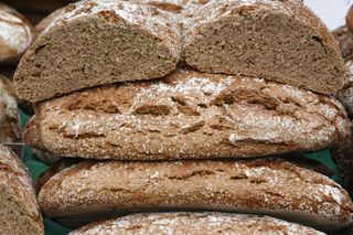 Loaves of whole wheat bread stacked on top of each other