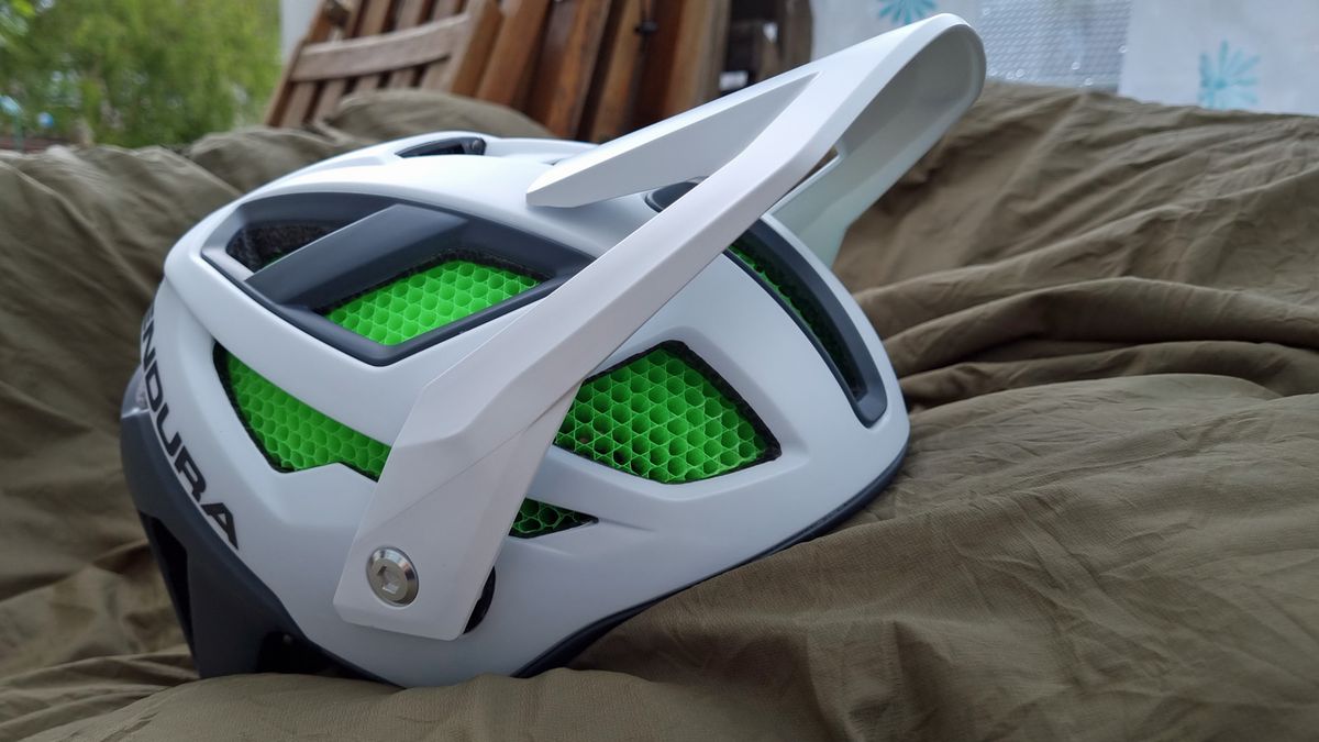 A side view of the Endura MT500 Mips helmet with the visor raised