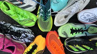 A selection of carbon-plated running shoes photographed from above arranged in circular fashion