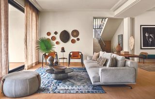 A light blue rug in a living room