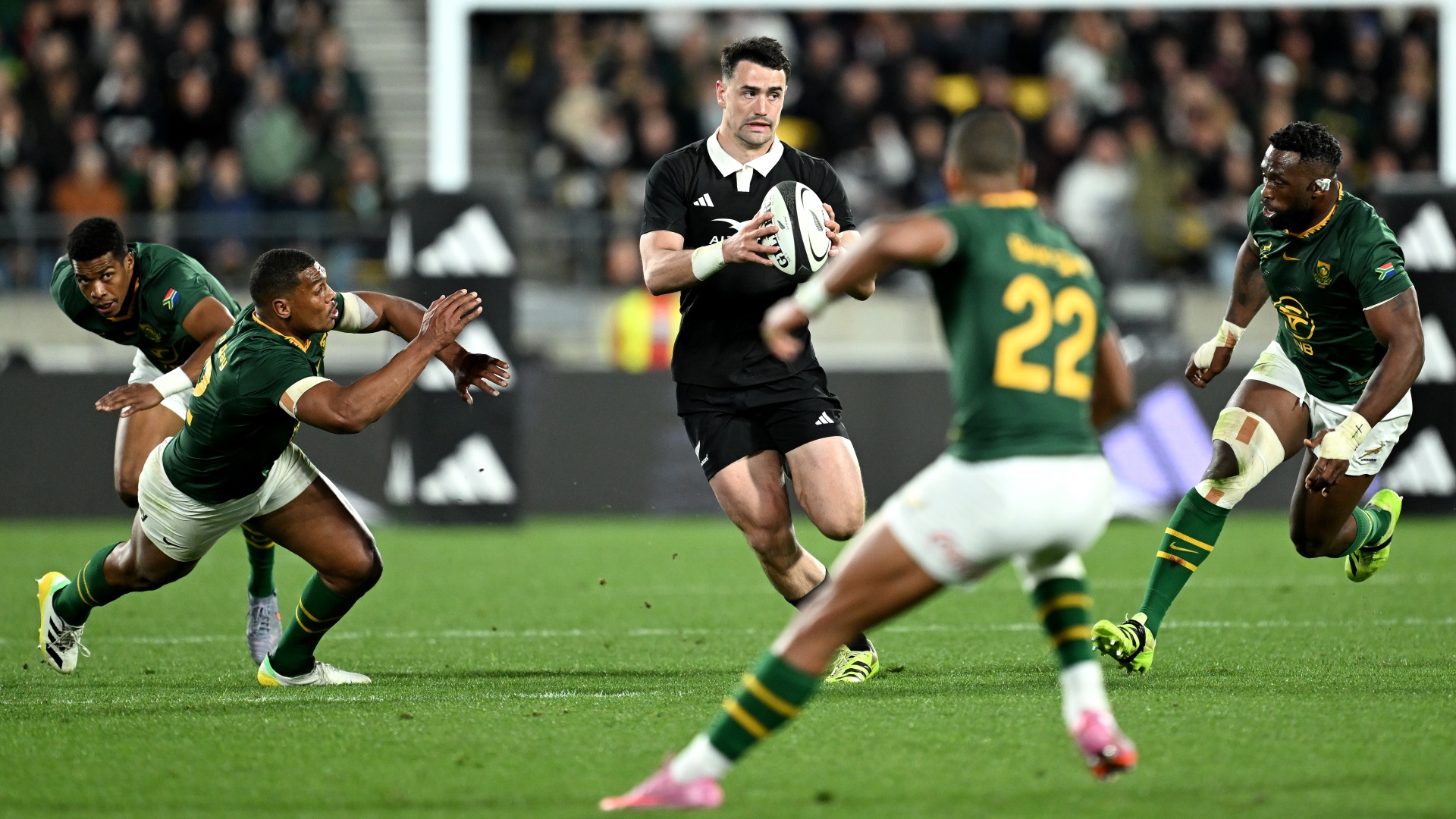 The All Blacks' Will Jordan carrying the ball against the Springboks