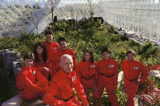 Biospherians (left to right): Jane Poynter, Linda Leigh, Mark Van Thillo, Taber MacCallum, Roy Walford (in front), Abigail Alling, SallySilverstone and Bernd Zabelposing inside Biosphere 2 in 1990.
