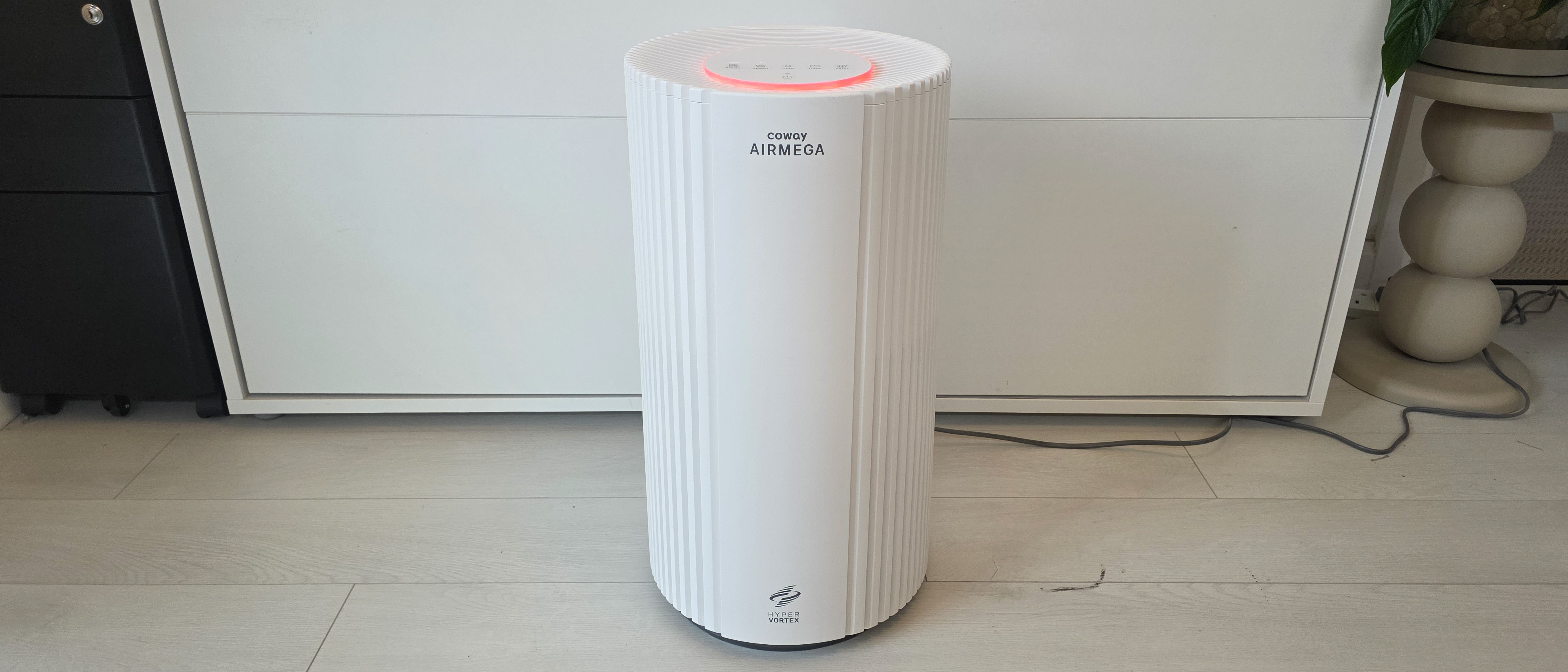 The Coway Airmega 350 from the front showing off its whole body and multicolor lighting.